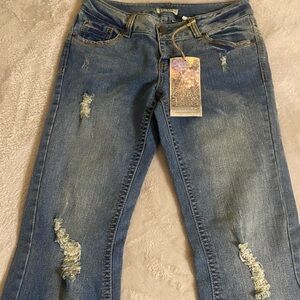 NWT Women’s Paris Blues Distressed boot cut. Junior size 11. Slight stretch